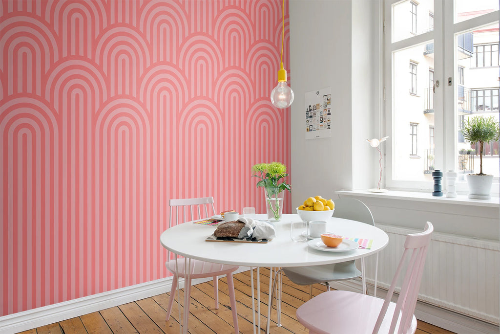 Arch Hills, Geometric Wallpaper in pink featured on a wall of a dining area with round table and wood flooring 
