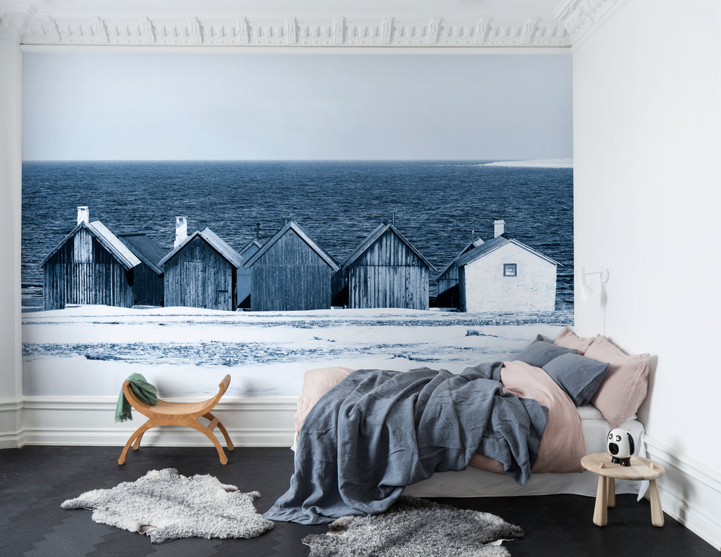 Boathouse Blues, Landscape Mural Wallpaper, featured on wall of a bedroom with comfortable cushion and soft fabrics and sheets