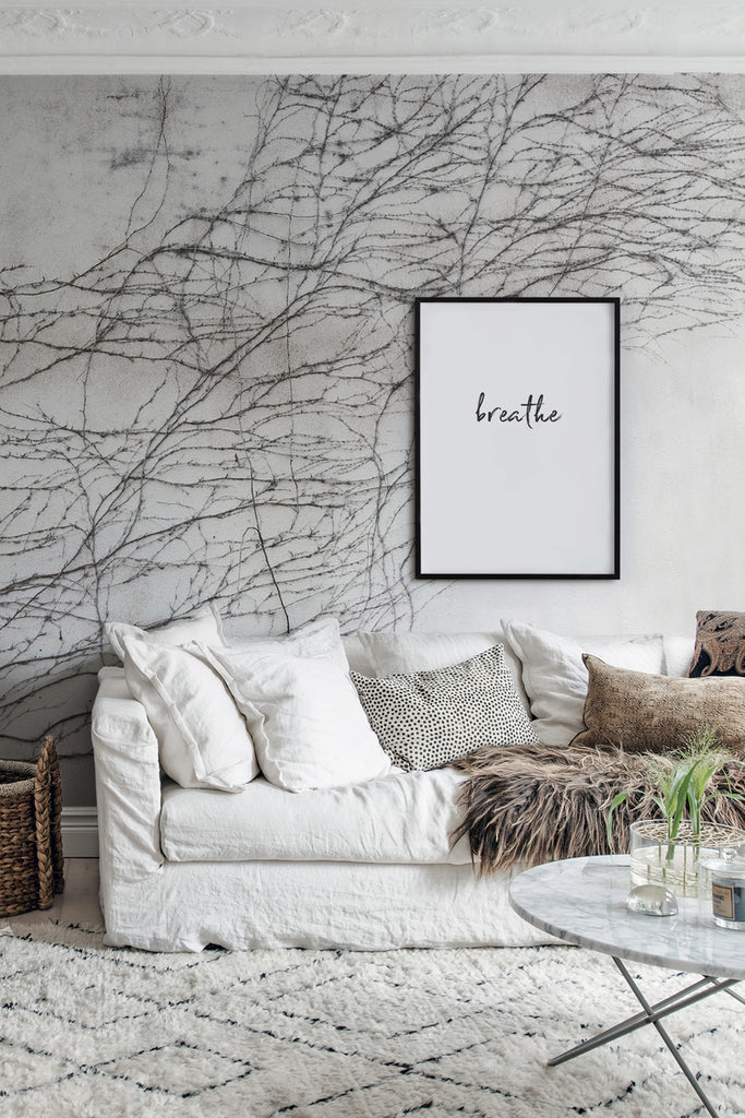 Closed up Breathe, Nature Mural Wallpaper featured on the wall of a living area with white sofa and neutral color cushion