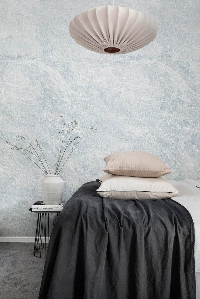 Closed up Breeze, Waves Mural Wallpaper in blue featured on the wall of a cozy bedroom