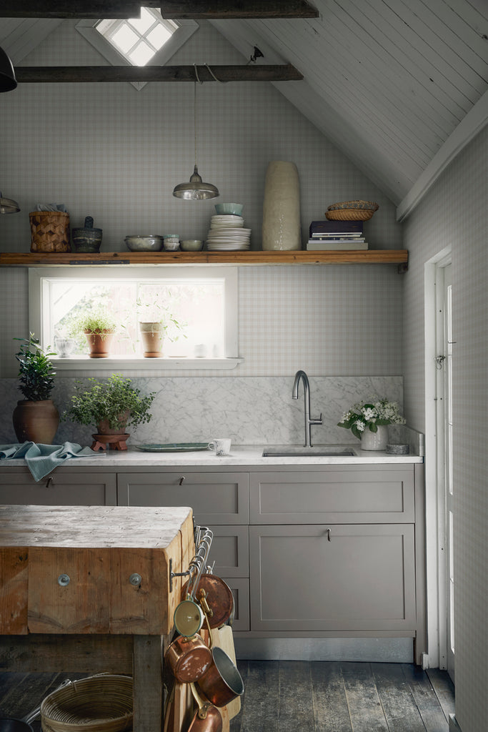 Herman, Plaid Pattern Wallpaper in sand featured on a wall of a kitchen area with wooden furnitures that matches a country ambiance 