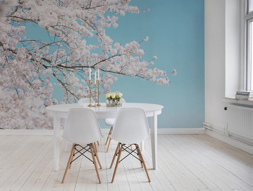 Japanese Cherry Tree, Mural Wallpaper featured on the wall of a dining area with round white table and chair along with a white wood flooring