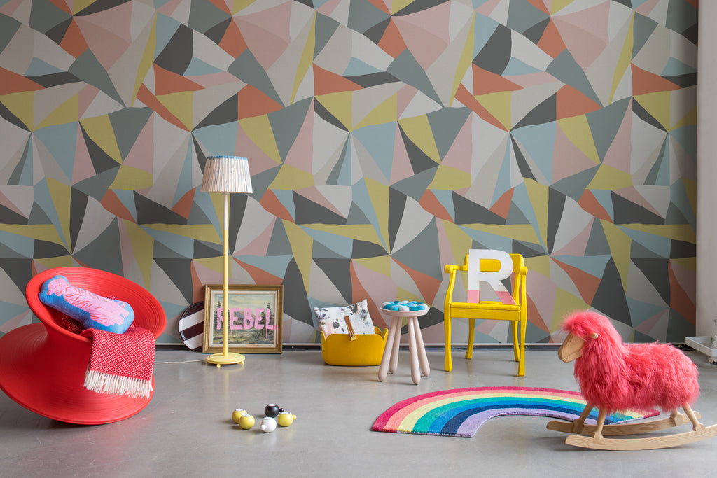 Retro Geometric, Wallpaper as seen on the wall of a child’s playroom with rainbow floor mat and several toys