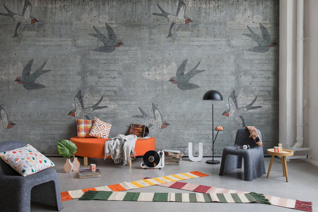 Swallow Flight, Pattern Wallpaper in grey featured on a wall of a kid’s playroom with several scattered toys 