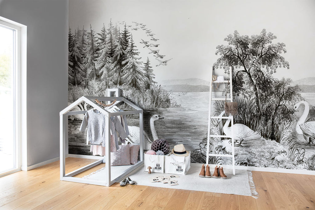 Swan Lake, Nature Mural Wallpaper in dark grey featured on a wall of a child’s playroom, with a wooden white ladder and house frame for kid’s closet. 