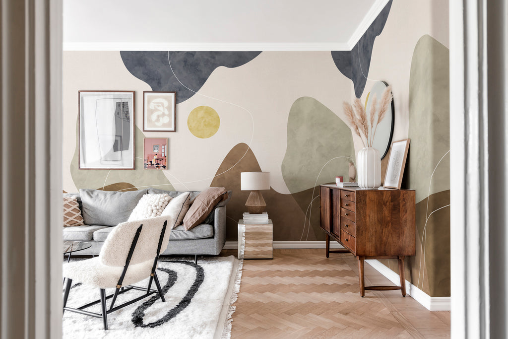 Terrain Bold, Mural Wallpaper graces a cozy living area, where it complements a soft sofa set, creating an inviting and comfortable atmosphere.