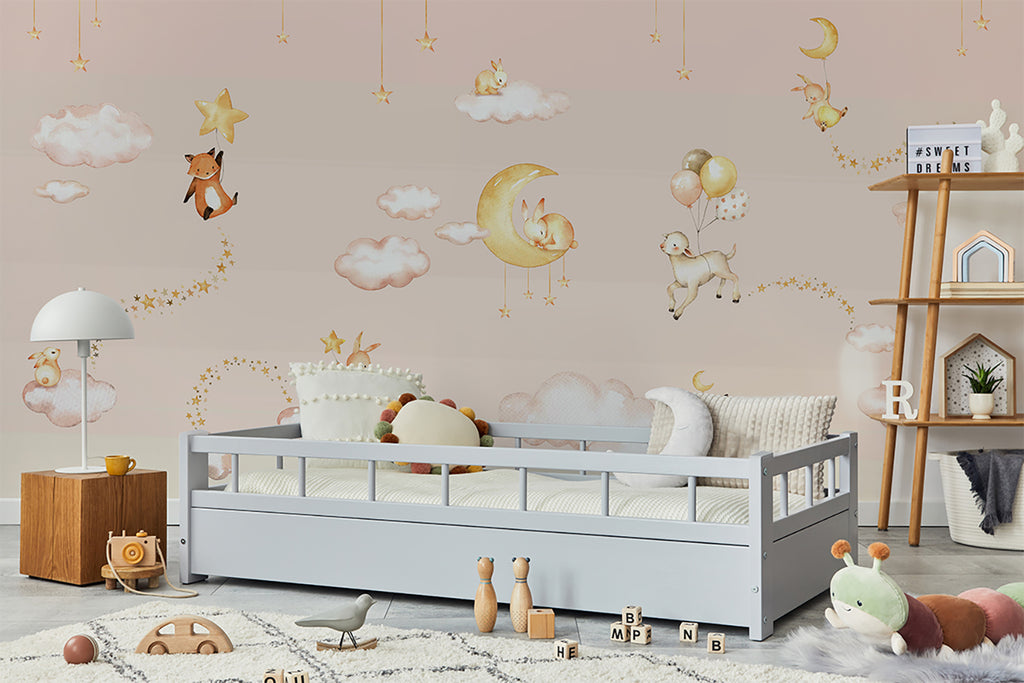 A serene children’s room adorned with Twilight Safari, Animal Mural Wallpaper in Pink. The room features a white crib, wooden toys, and a soft rug, creating a peaceful and imaginative atmosphere.