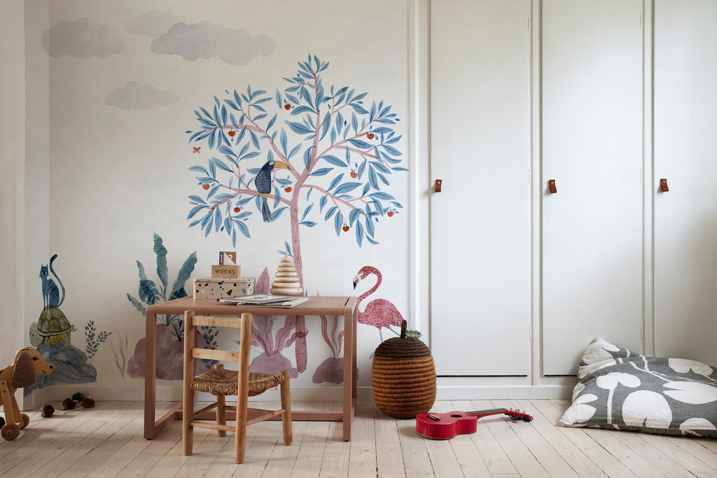 Wilton and Friends, Wallpaper in Multicolor Featured on a wall of a kid’s study room with a wooden study table, and toys scattered around