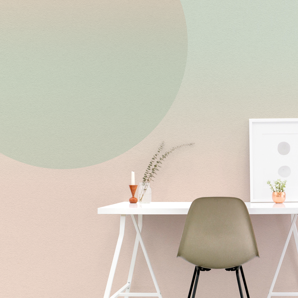 Dusk Hour, ombre wallpaper in complementary green, pink, and nude hues in study room with table and photo frame