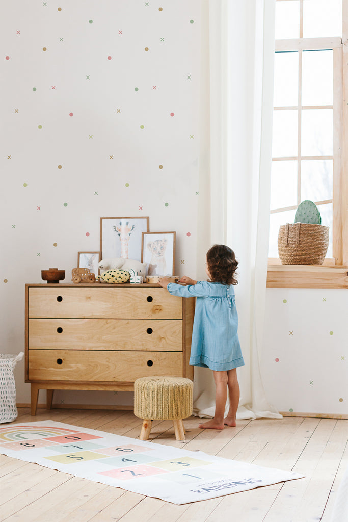 Tic Tac Toe, Pattern Wallpaper in a vibrant multicolor palette sets the stage for fun and games in a child's playroom.