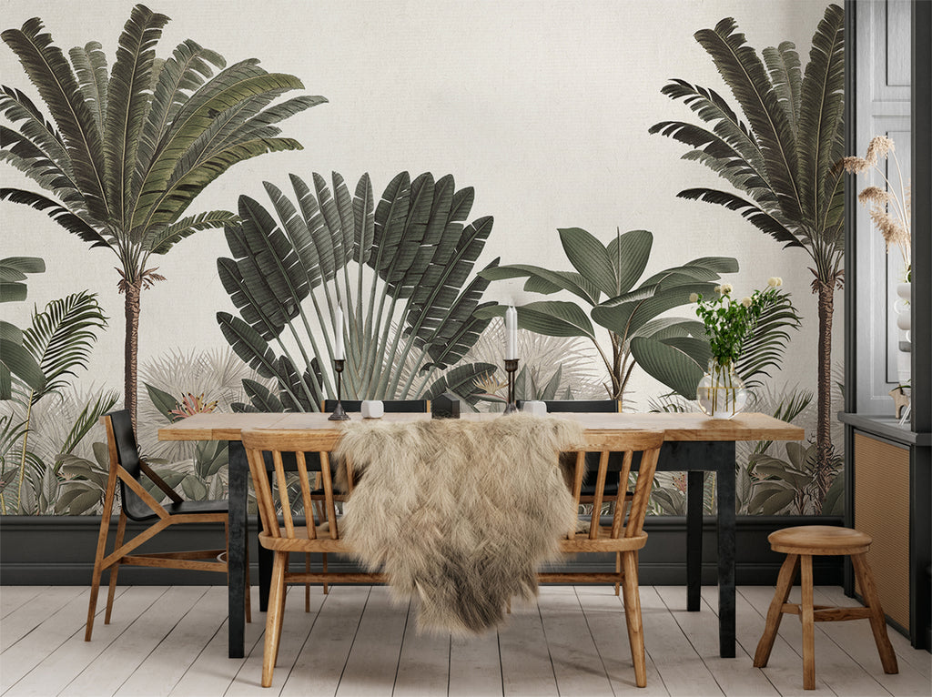 Palm Paradise, Tropical Mural Wallpaper in green, as seen in a dining area with wooden chairs and table as furnishing and white wook plank flooring