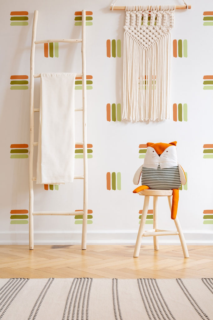 Bold Lines wall decal in a room with a ladder hanger and soft toy atop a stool.