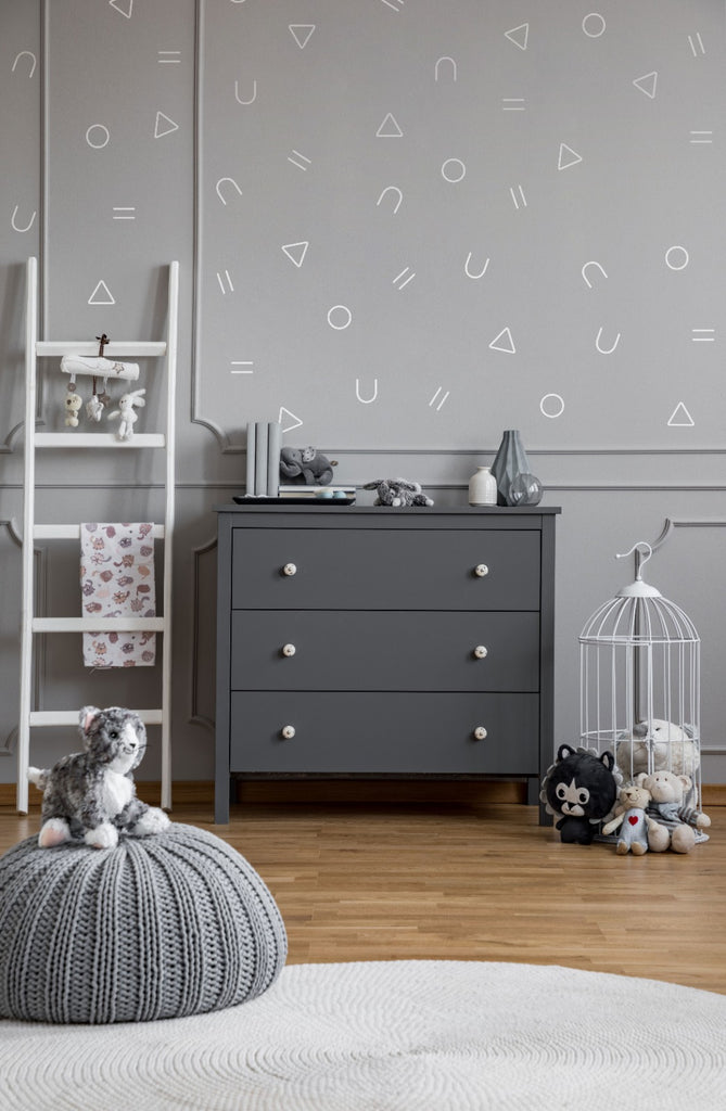 Geometric Confetti Wall Decals in a kid's room with grey cabinet and white ladder