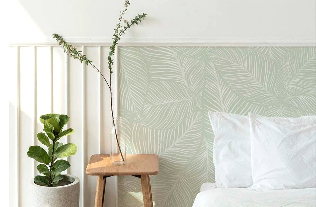 Leaf pattern Noelle fern wallpaper on bedroom headboard