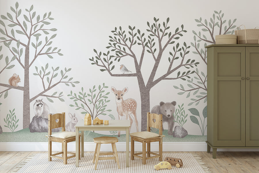 Mural wallpaper features adorable woodland creatures nestled among leafy foliage 