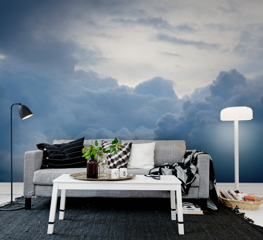 Above the Clouds, Sky Mural Wallpaper, featured on a wall of a living area with soft pillows and fabrics