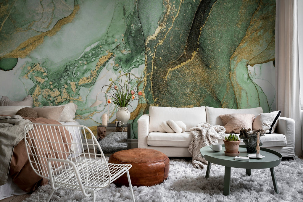 Agate Crystal Marble Texture Wallpaper in Green featured on a wall of a living room with white sofa, white metal mesh chair, and a teal round table at the center, a furry white floor mat is in the middle.