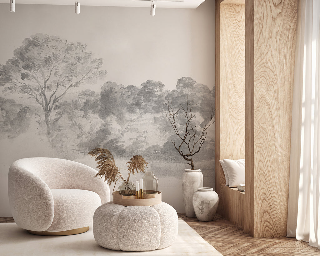An elegant room adorned with An Old World Arboretum watercolour mural wallpaper in Black and White, featuring modern furniture like a white sofa and round pouf, bathed in natural light.