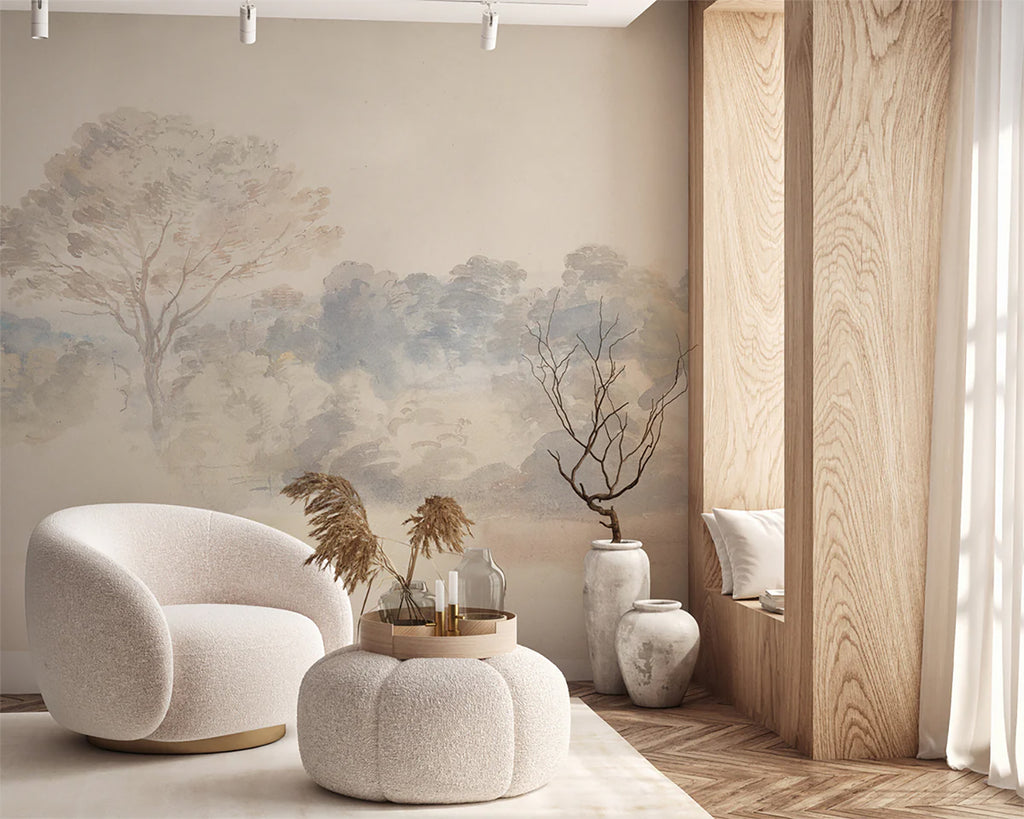 An elegant room adorned with An Old World Arboretum watercolour mural wallpaper in Vintage, featuring modern furniture like a white sofa and round pouf, bathed in natural light.