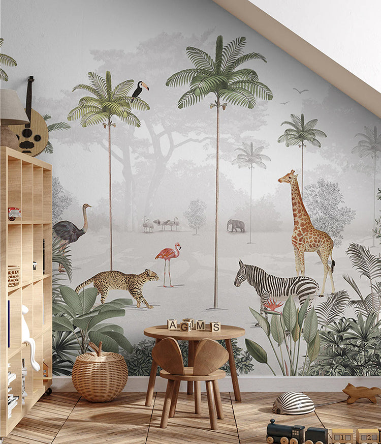A cozy room with wooden flooring, a round table with chairs, and a shelf filled with toys. The wall features the Animal Paradise, Mural Wallpaper depicting a serene jungle scene.