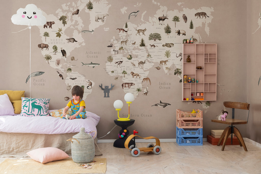 Animal World, World Map Mural Wallpaper in nude featured in a kid’s room with toys and furnitures for children
