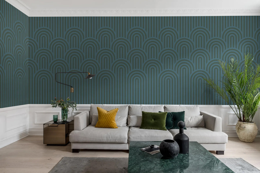 Arch Hills, Geometric Wallpaper in Emerald Green featured on a wall of a grey sofa and multicolored pillows and jade green table