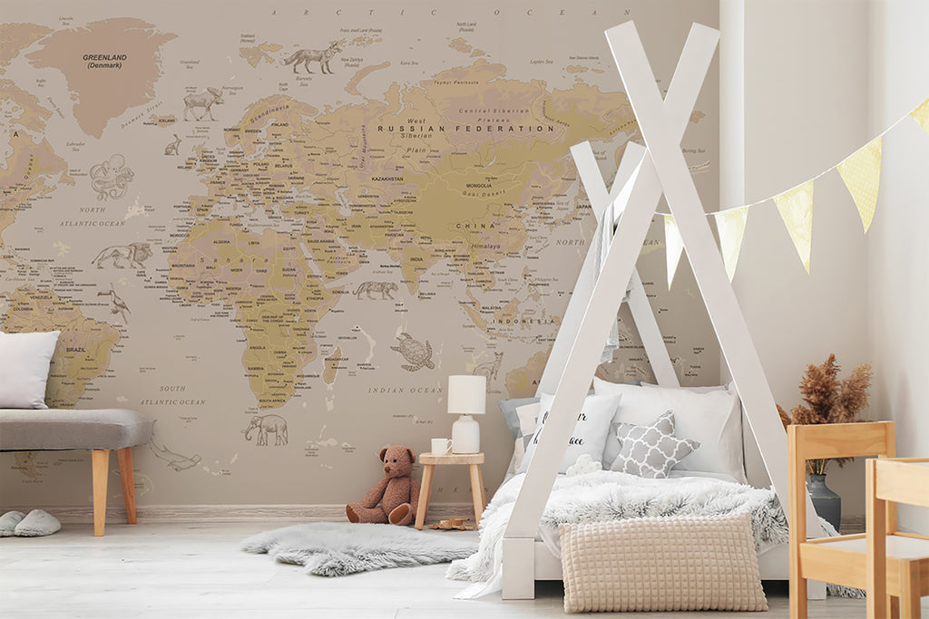 A room radiates warmth and comfort, furnished with a gray sofa and wooden chair. The Atlas Jungle, World Map Mural Wallpaper adds a unique touch, enhancing the modern aesthetic of the space.