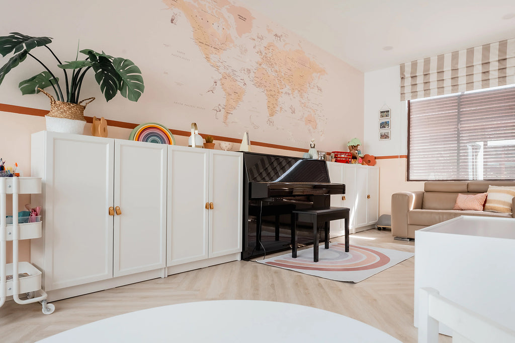 An inviting room featuring a grand piano and modern furniture. The Atlas Jungle, World Map Mural Wallpaper subtly enhances the educational ambiance. Natural light highlights the room’s diverse textures.