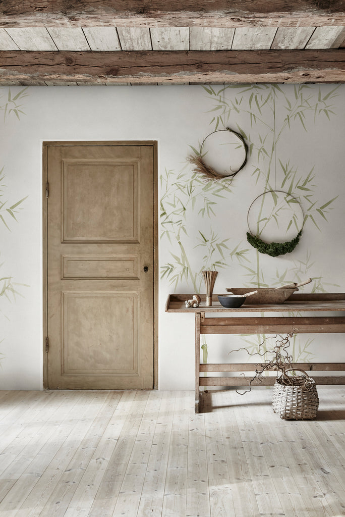 Bamboo Garden, Japanese Mural Wallpaperfeatured on a wall near a door and a wooden table with kitchen wares on top