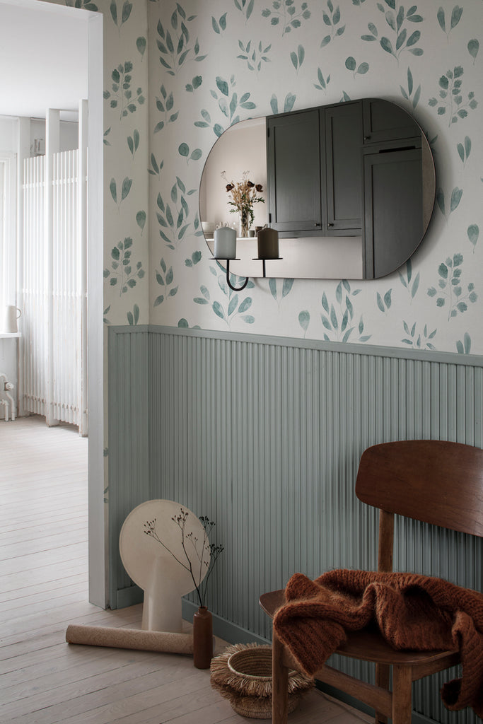 Belle Foliages, Tropical Pattern Wallpaper in Dark Blue featured on a wall a hallway with a wooden chair along the way and a mirror on the wall