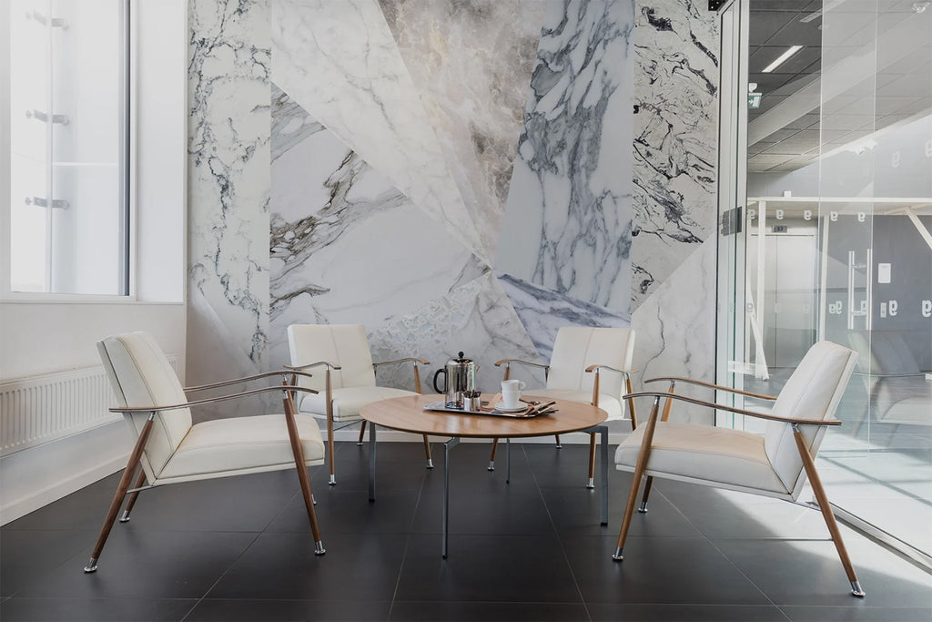 Big Diamond Marble, Geometric Wallpaper featured on a wall of a conference room with round table and chairs with black flooring