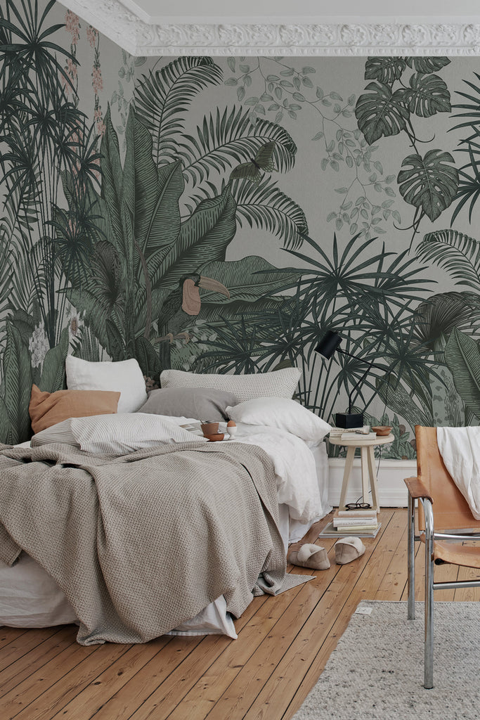 Big Furada, Tropical Mural Wallpaper in white featured on a wall of a bedroom adjacent to a window giving the room a cozy look 