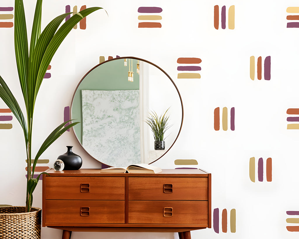 A stylish room with wooden mid-century furniture, including an open-drawer dresser displaying books. A round mirror hangs above, reflecting a potted plant. The walls feature muted old Lines, Wall Decals in Brown-Purple-Beige Close Up