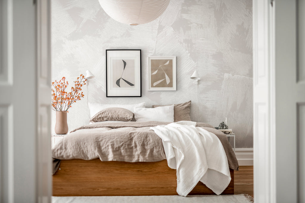 Brush Mural Wallpaper, featured on a wall of cozy bedroom with framed art and japandi pendant lights 