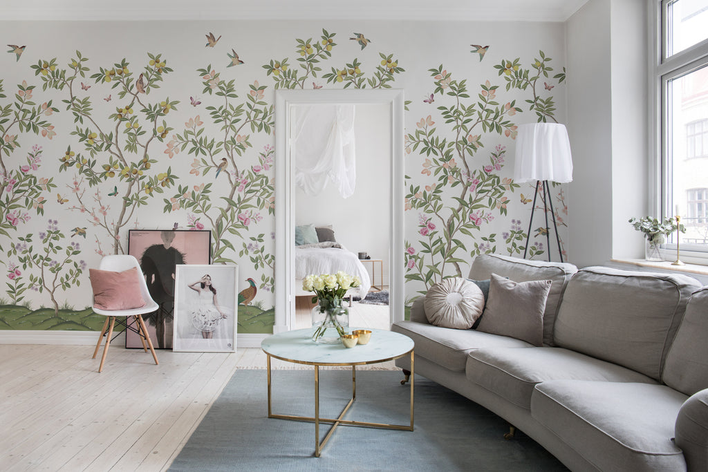Chinoiserie Forest, Mural Wallpaper in Green featured in a living area with round table and fa vase of flower