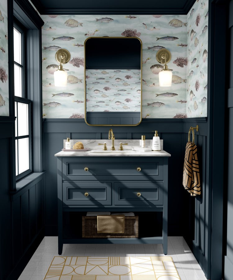 Classic Fish, Pattern Wallpaper in Blue a charming wallpaper design, creating a calming and aquatic ambiance. The room includes a dark blue vanity, gold accents, a stylish mirror, and two wall-mounted lights.