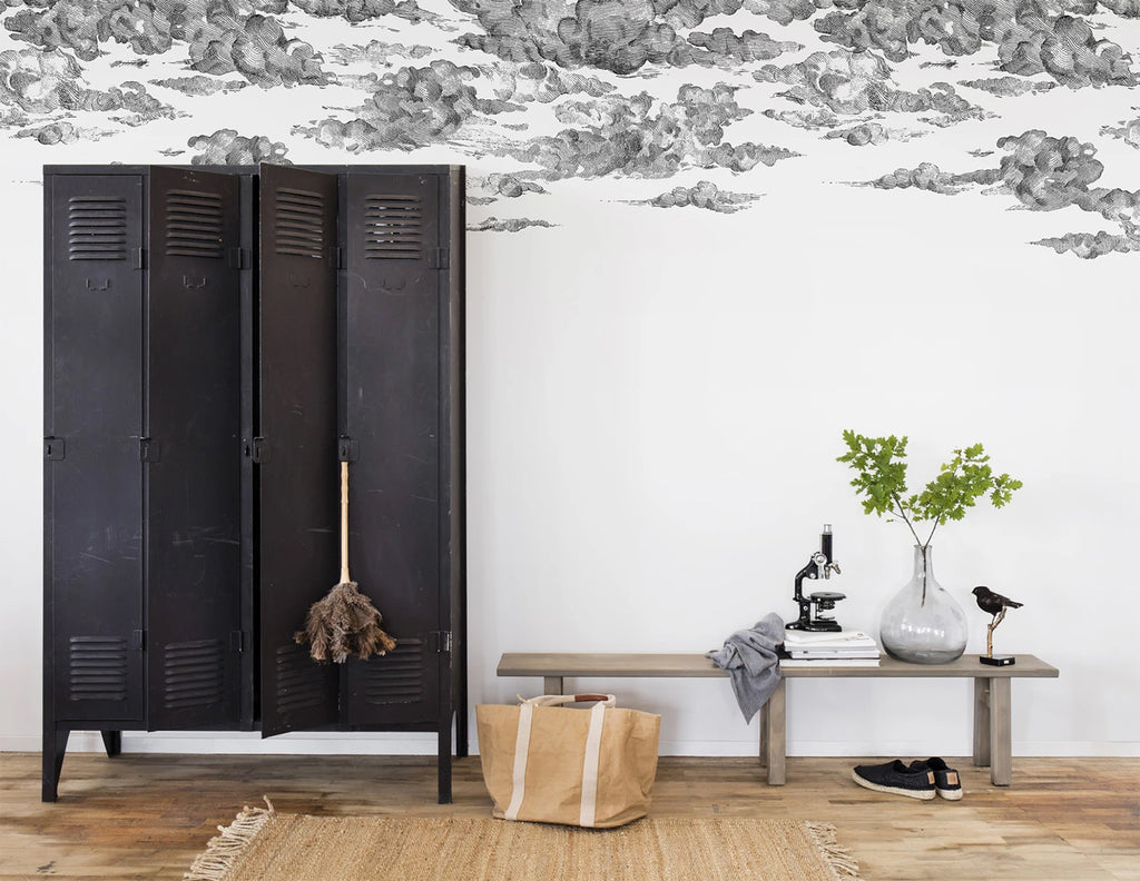 Cotton Skies, Mural Wallpaper in Black featured on a wall of a room with black locker and wooden bench