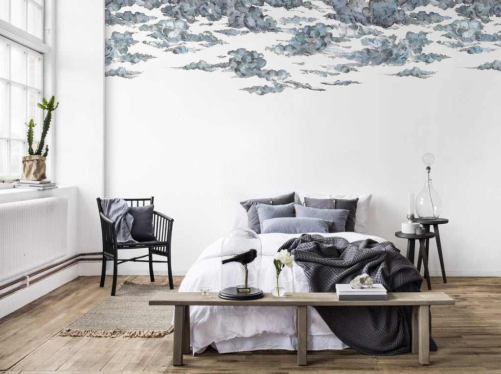 Cotton Skies, Mural Wallpaper in Blue featured on a wall bedroom with black and white bedsheets and grey pillows