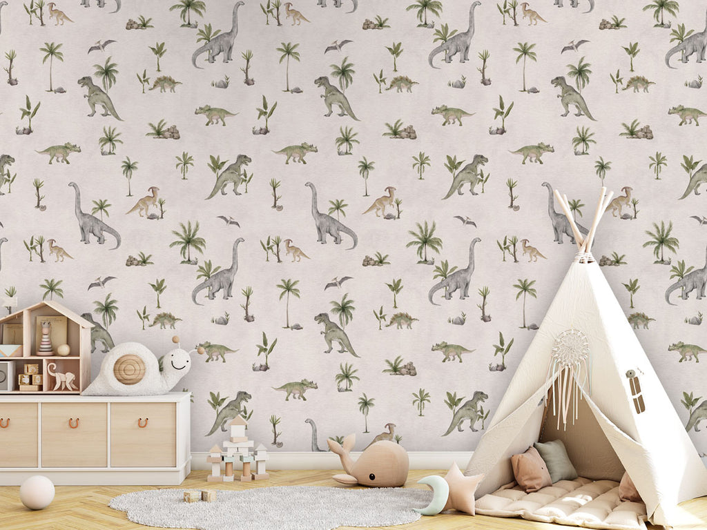 Dashing Dino, Pattern Wallpaper in white, the children's room includes a wooden storage unit with drawers and leather handles, topped with decorative items like a wooden house and a stuffed snail toy. There is also a white teepee tent with a cushioned mat and a dreamcatcher hanging at the entrance, various toys like a wooden stacking toy and a star-shaped cushion, and a round, light-colored rug on the floor.