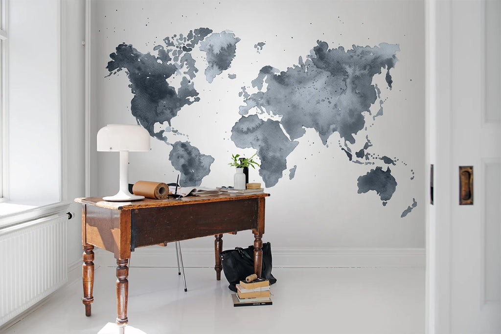 Dusky World Map, Mural Wallpaper as seen on a wall of a room with vintage brown table and white flooring
