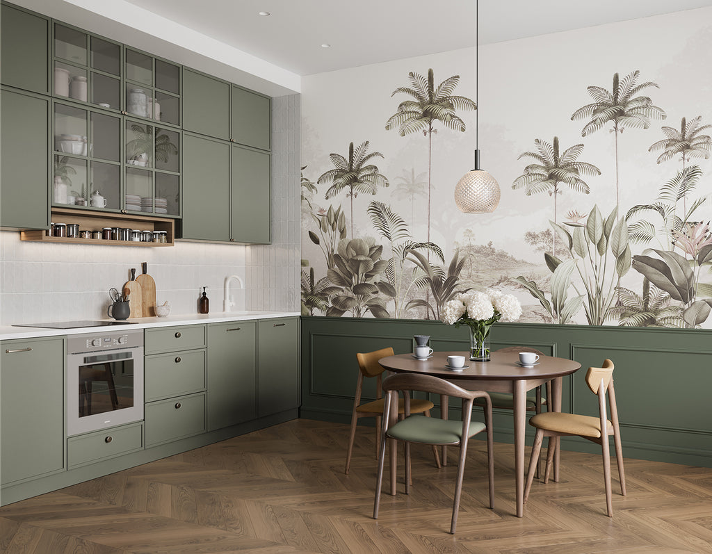 A modern, well-lit kitchen with green cabinets and a wooden dining set. The room is adorned with an Elegant Rainforest, Tropical Mural Wallpaper in Sand.