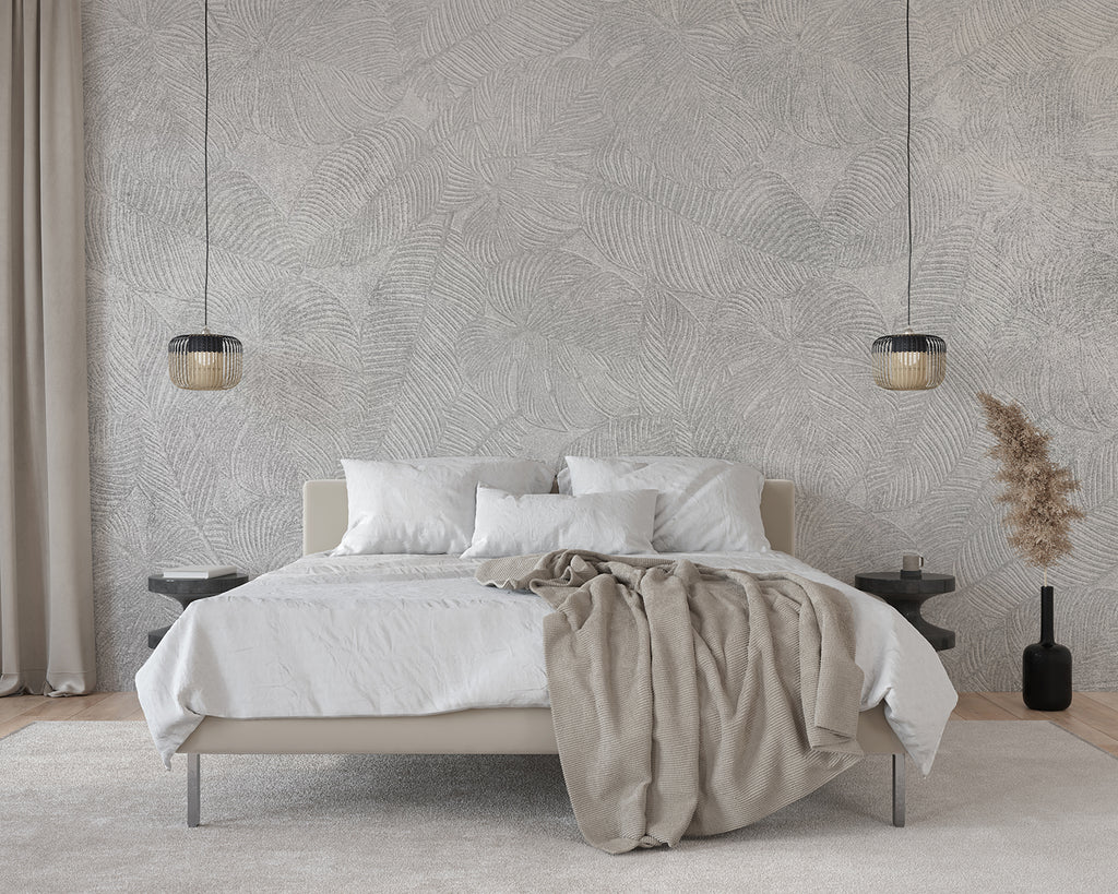 Serene bedroom adorned with Erin Stone Foliage, Faux Texture Wallpaper. The room features a white bed, beige throw blanket, pendant lights, and minimalistic decor, creating a tranquil atmosphere.