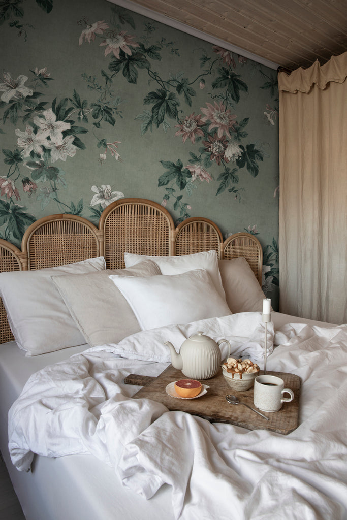 Faded Passion, Floral Wallpaper in green featured on a wall of a bedroom wiith a bed with white pillows and sheets and on it a is a breakfast in bed