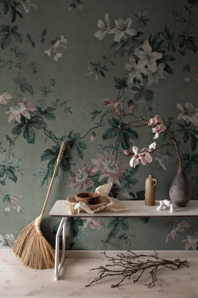 Faded Passion, Floral Wallpaper in blue featured closeupFaded Passion, Floral Wallpaper in green featured on a wall of a room with a wooden table with assortment of furnitures