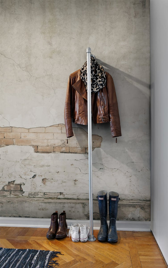 Frontage Brick, Wallpaper featured  featured on a wall of a foyer with wooden flooring and a line of boots and shoes along with a cloth rack
