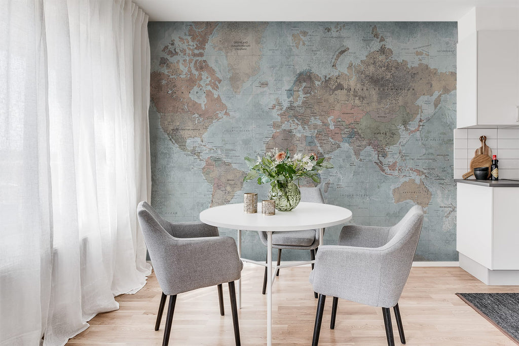 Globetrotters World Map, Wallpaper featured on a wall of a room with white round table with vase on it and grey chairs