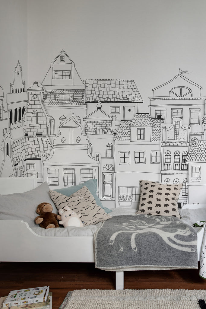 London Houses, Mural Wallpaper in Black White featured on a wall of a bedroom with pillows