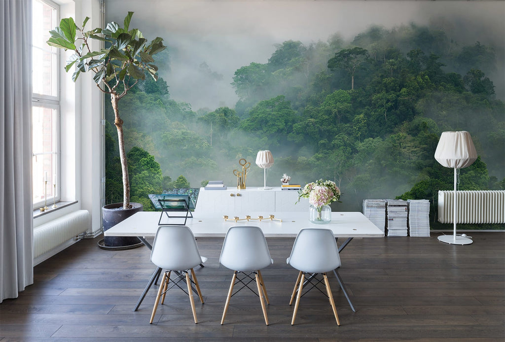 Misty Jungle, Landscape Mural Wallpaper featured on a wall of a dining area with white dining table and chairs