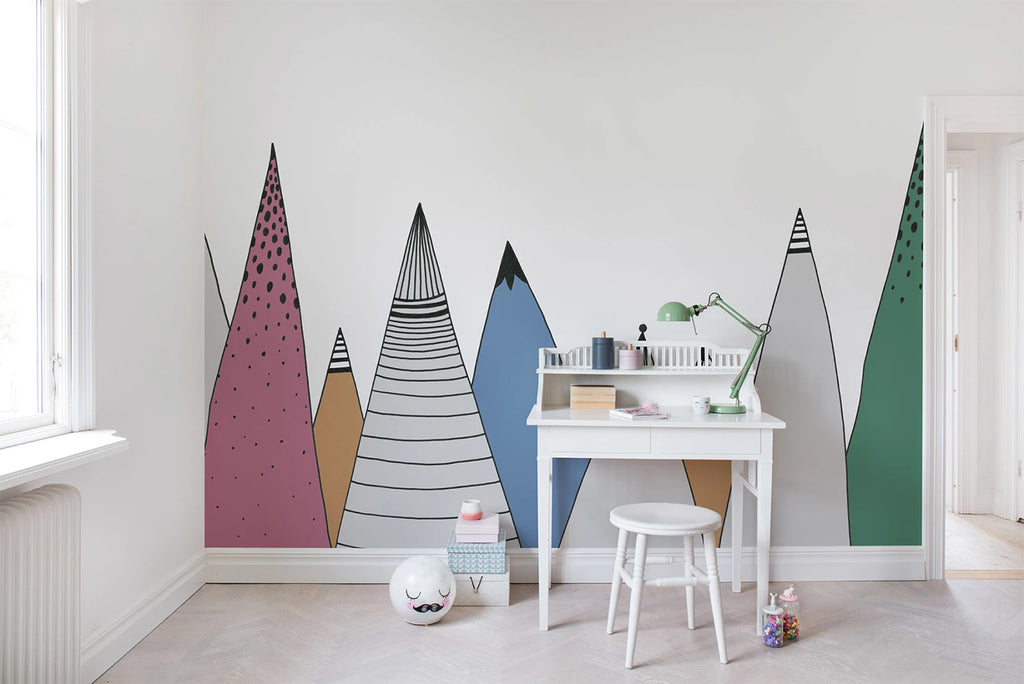 Mountain Ridges, Mural Wallpaper in multicolor featured on a wall of a kid’s room with white study table and stool with toys around it