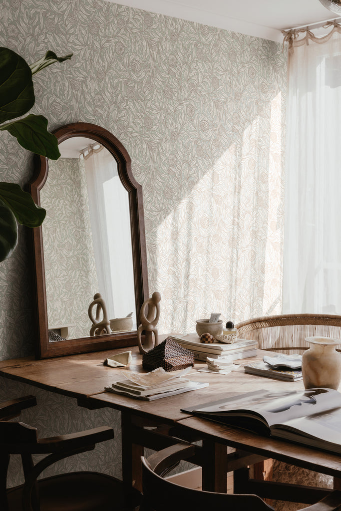 Olof, Floral Pattern Wallpaper in Green featured in an office with wooden chairs and table, and mirror and books on top of it.